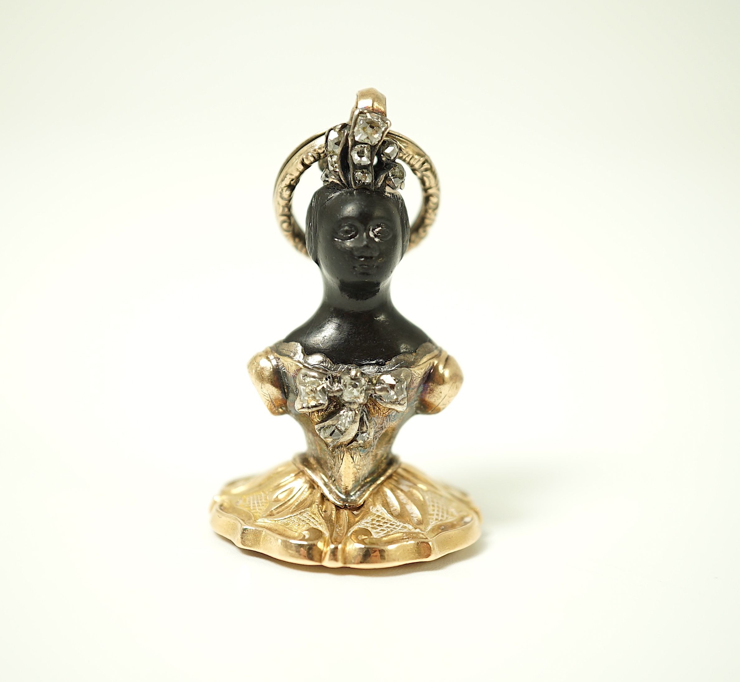 A 19th century gold overlaid, emerald and diamond set double sided Blackamoor seal pendant